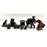 A small lot of various carved hardwood and cast resin animal figurines, to include whippet,