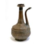 An 18th/19th century copper, possibly Afghan, water jug (af, with solder repairs), 40cmH