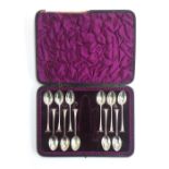 A set of 11 silver teaspoons, William Hutton & Sons (Edward Hutton), London 1892, cased, 3.7ozt