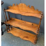A 19th century three tiered spice rack, with turned supports, 56cmW