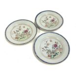 Three Chinese porcelain plates with polychrome decoration depicting birds in a garden, 23cmD