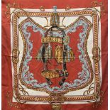 A Hermes 'Bride de Cour' brick red silk scarf, designed by Francoise de la Perriere, 90x90cm