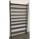 A set of industrial style fabricated steel shelves, formed in two stacking sections, comprising nine