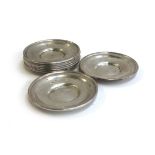 A set of eight white metal pin dishes, tested as silver, each marked 'Sterling', 8.8cmD, 223g, 7.