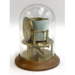 A compact drum barograph with glass dome, Russell, Norwich, 17cmH with spare paper and ink