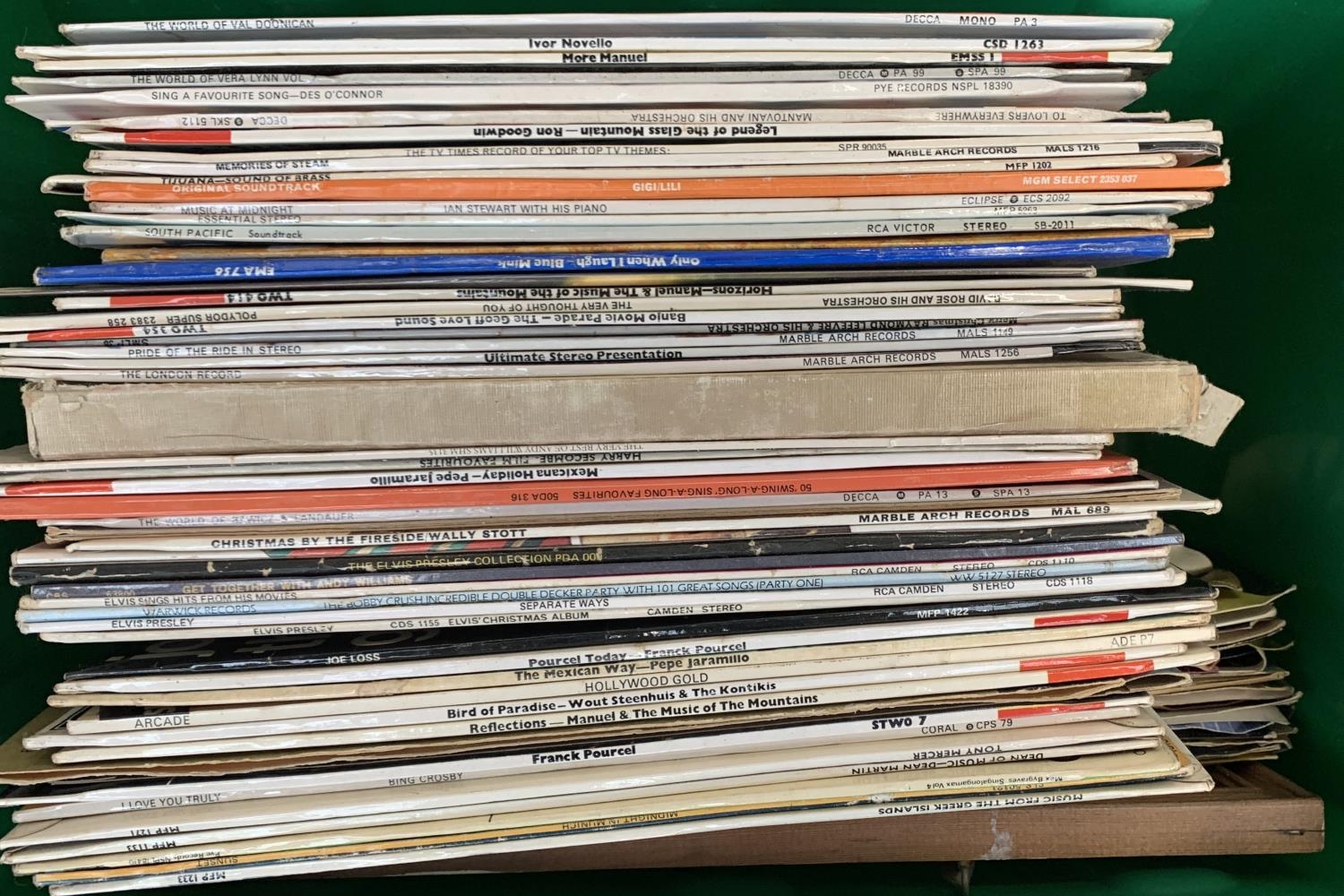 A mixed box of vinyl LPs and singles to include Elvis Presley, etc