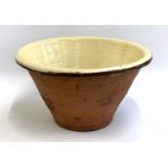 A 19th century terracotta glazed dairy bowl, 38.5cmD, 25cmH