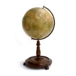 An antique Philips 12" Library Globe on turned mahogany base, the label reading 'George Philip & Son