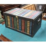 A wooden storage box with painted leaf of book spines, 47cmW