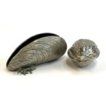 A white metal mussel shell, 19cm long, together with a nutcracker in the form of a walnut