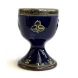 A Royal Doulton stoneware eggcup with hallmarked silver rim, 6.5cmH