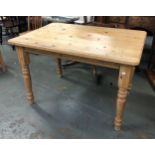 A 20th century pine kitchen table, on turned legs