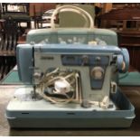 A Jones sewing machine in hard plastic case