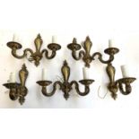 A set of 3 two arm wall sconces together with 2 single arm sconces and a quantity of unmatched