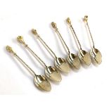 A set of six .925 silver teaspoons, each with silver gilt floral terminal