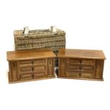 A pair of wooden jewellery boxes; together with a small wicker picnic hamper (3)