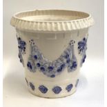 A blue and white ceramic planter with swags, 38cmH, 42cmD