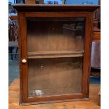 A mahogany medicine cabinet, moulded cornice, glazed door with bevelled glass, 49x17x59cmH