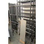 A set of industrial style fabricated steel shelves, formed in two stacking sections, comprising four