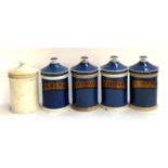 Four blue ceramic chemist's jars (lids af), together with one other, 25cmH