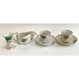 A pair of a Spode teacups and saucers, pattern no. 2527, together with a matching gravy boat and