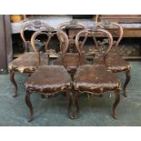 A set of five Victorian walnut balloon back dining chairs