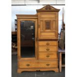 A 20th century ash compactum wardrobe, with mirrored door opening to a hanging rail, with various