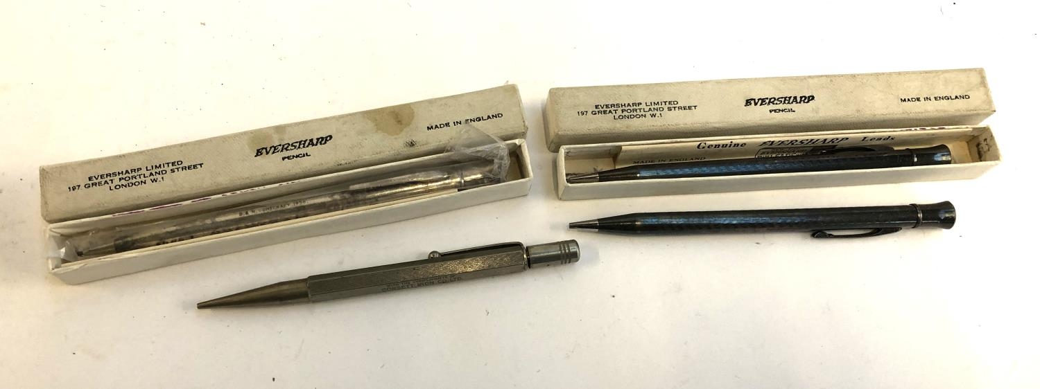 Four propelling pencils, three silver plated Eversharp including one sealed in box (4)
