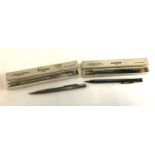 Four propelling pencils, three silver plated Eversharp including one sealed in box (4)