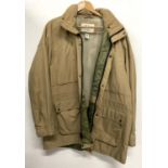 An Orvis cotton fishing jacket with concealed hood, size XL
