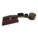 A pair of velvet pin cushions with gilt metal details, together with maroon leather wallet and a