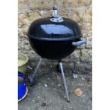 A Weber garden BBQ with rack