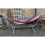 A garden hammock on a metal frame