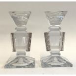 A pair of Czech press moulded and clear glass candlesticks, acid marked 1935, 21.5cmH