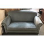 A Victorian two seater sofa, on turned legs and bun feet, 148cmW