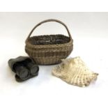 A conch shell, 26cmL; together with a wicker basket and cased binoculars