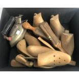 A number of beechwood shoe trees and a vintage iron