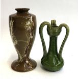 An Art Nouveau three-handled vase, 17cmH, and an Empire Porcelain Co. marble effect vase, c1924 mark