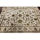 A large cream ground floral wool rug, 315x240cm