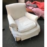 A good Victorian armchair, with loose cover, on turned front legs, 88cmW