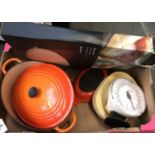 A box of kitchenalia inc. Le Creuset large casserole, 'Pizza Stone' ceramic plate (John Lewis), etc