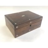 A rosewood sewing box with mother of pearl inlay, 30x22.5x12cm