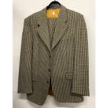 A Frederick L Mabb two piece tweed suit with single breasted jacket, tapered trousers