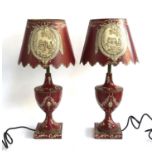 A pair of toleware tablelamps, of baluster form, with tole shades, decorated with floral swags,