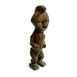 A large colonial period copper clad West African power figure, having cowrie shell eyes, metal