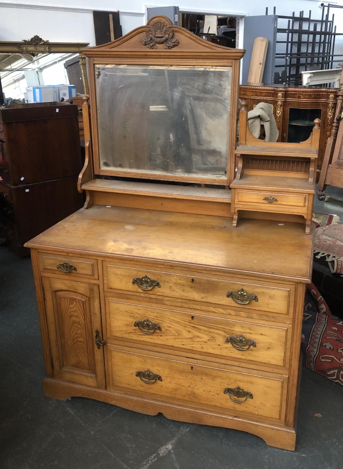 An early 20th century ash dressing table, with adjustable mirror and single drawer, base with