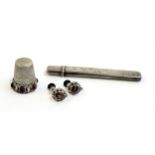 A pair of Arts and Crafts silver and red paste screw back earrings; an 800 silver thimble set with