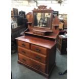 A mahogany chest of drawers/dressing table, with adjustable mirror, the base with two short over two