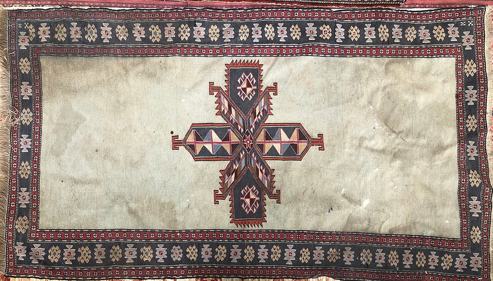 A Navajo rug with central cross motif, 205x115cm