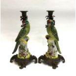 A pair of Wong Lee crackle glaze candlesticks in the form of parrots, with cast metal mounts, 36cmH
